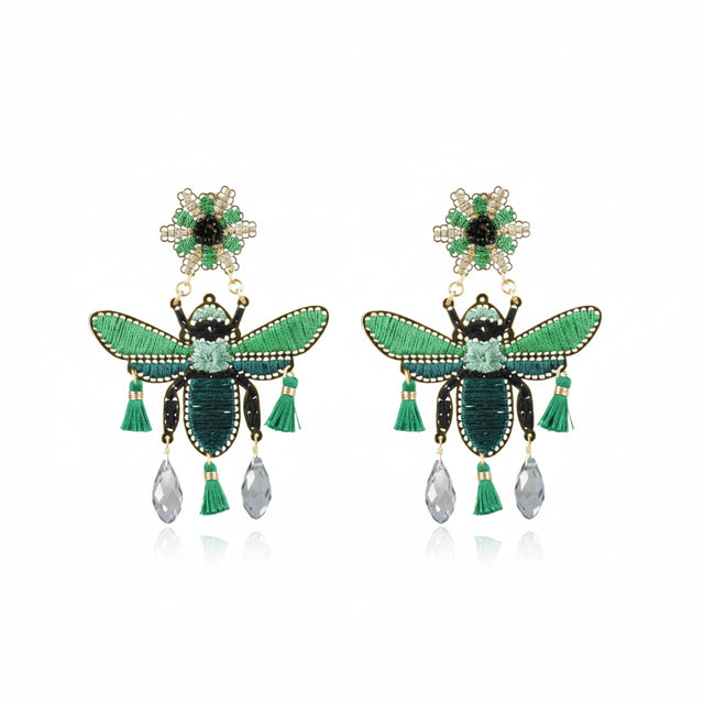 Vuelo earrings by Mercedes Salazar hand-embroidered in thread with semi-precious stones and gold-plated bronze details